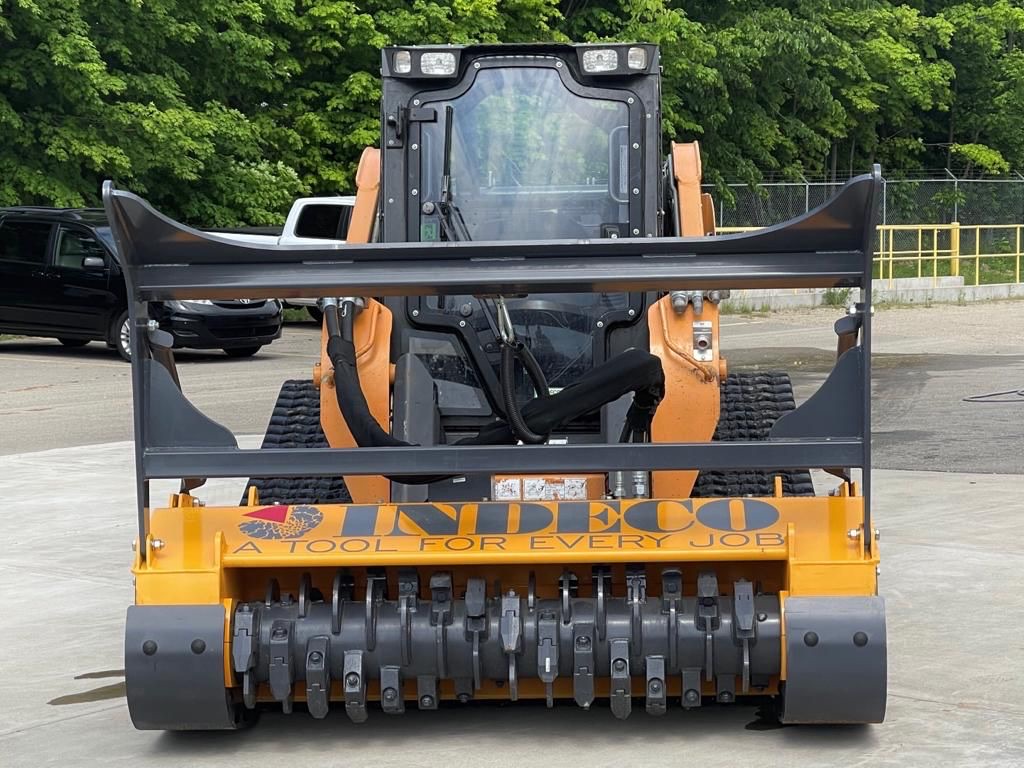Indeco forestry mulching head mounted on a skid steer