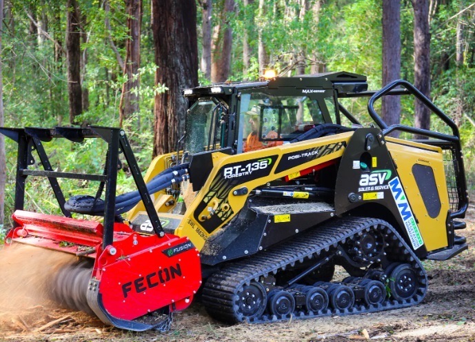 Tracked forestry mulcher clearing dense brush